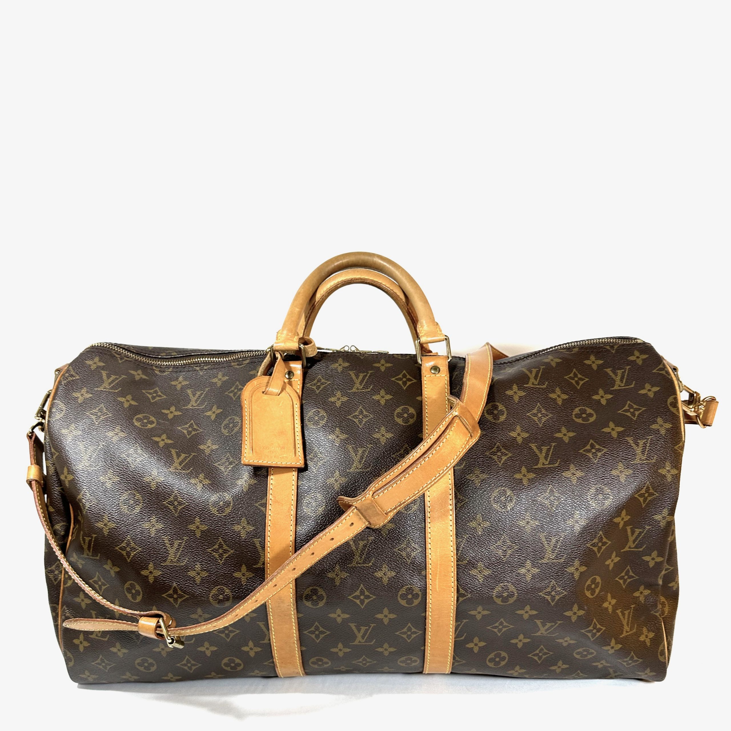Louis Vuitton lady's luxury travel handbag detail scarf and